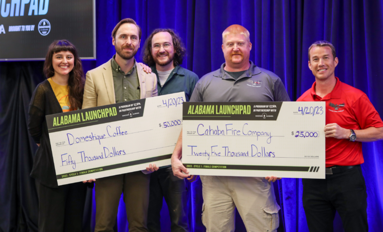 Domestique Coffee and Cahaba Fire Company Cycle 1 2023 finale winners with their prize checks